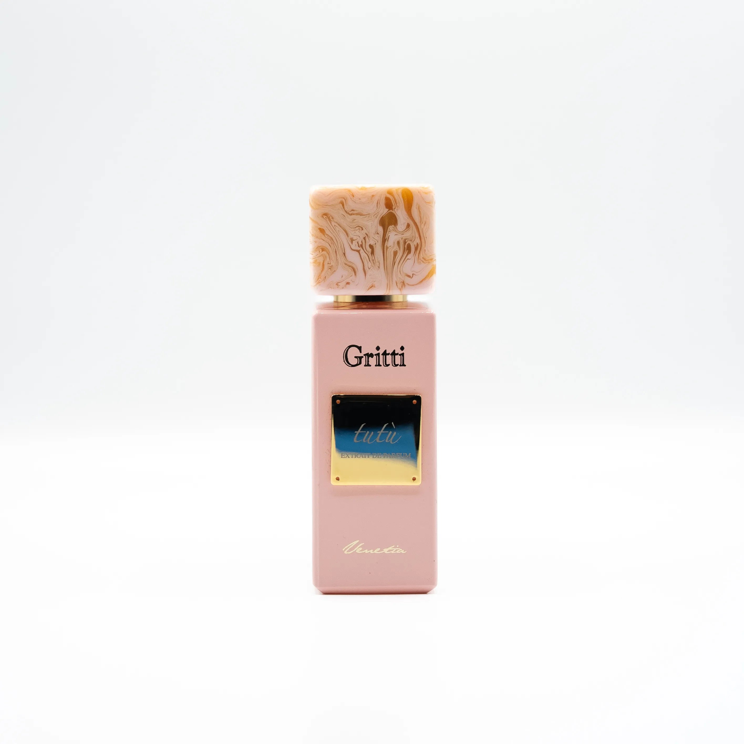 Pink Gritti perfume bottle with a decorative cap on a white background